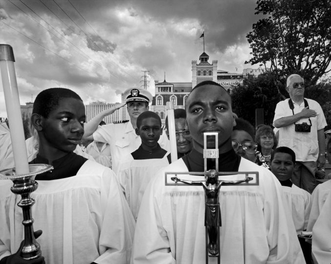 © Carl De Keyzer - Magnum Caption/Description: USA. New Orleans. Singing of the national anthem during the blessing of the Mississippi river by a catholic bishop. In the book, God, Inc.1992 1990-1991.